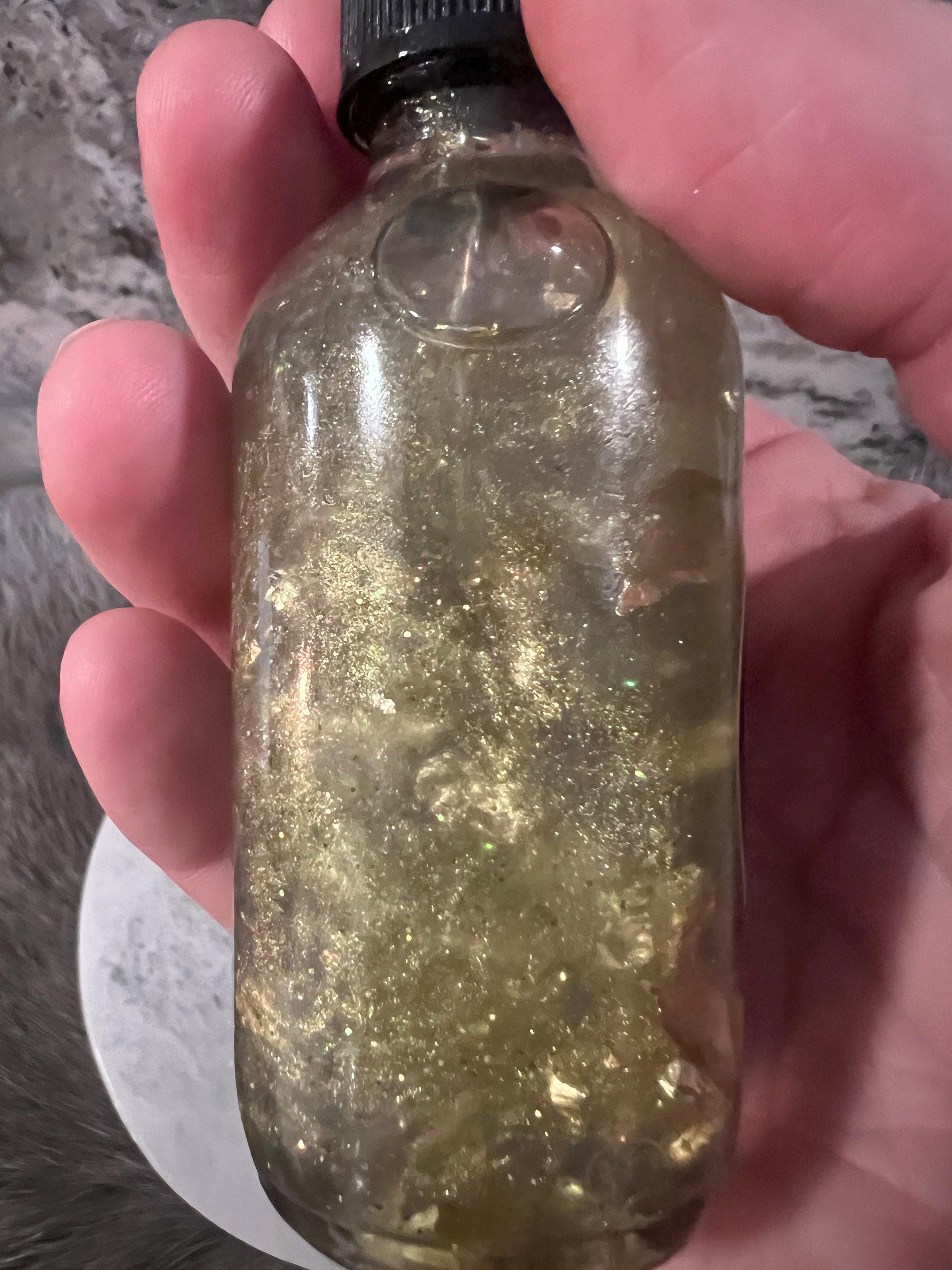 Manifesting Money Spell Oil: Gold Flakes, Jade & Peridot Infused (2oz)